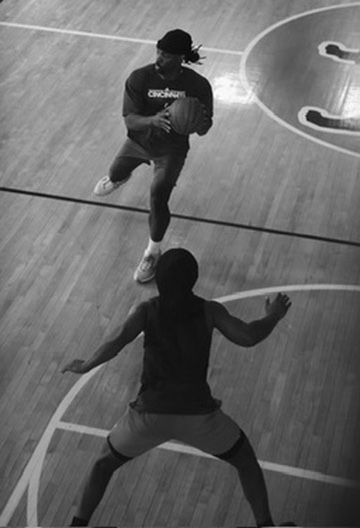Two W Club members playing one-on-one